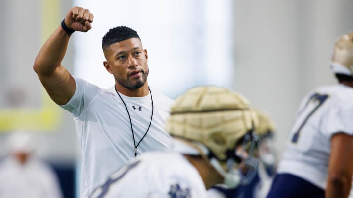 Notre Dame head coach Marcus Freeman warms up during a Notre Dame football practice at Irish Athletic Center on Thursday, Aug. 15, 2024, in South Bend.