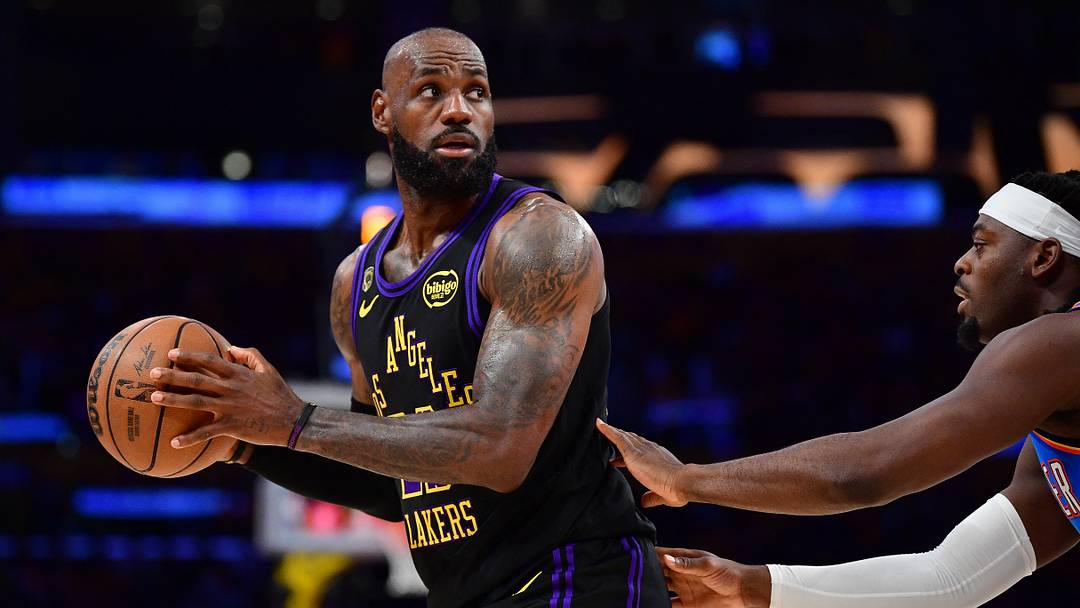 May 11, 2026; Los Angeles, California, USA; Los Angeles Lakers forward LeBron James (23) controls the ball against Oklahoma City Thunder guard Luguentz Dort (5) during the first half in game four of the second round of the 2026 NBA Playoffs at Crypto.com Arena. Mandatory Credit: Gary A. Vasquez-Imagn Images
