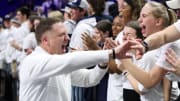 Penn State men's basketball coach Mike Rhoades celebrates a Nittany Lions victory with fans at the Bryce Jordan Center. 