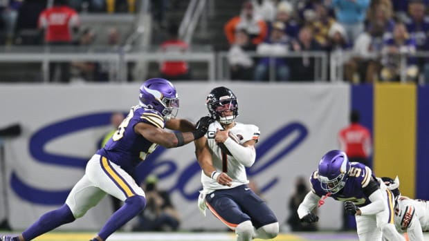 Chicago Bears quarterback Justin Fields (1) is tackled by Minnesota Vikings linebacker Danielle Hunter (99