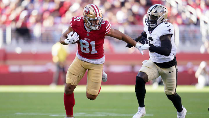 Aug 18, 2024; Santa Clara, California, USA; San Francisco 49ers tight end Cameron Latu (81) runs past New Orleans Saints linebacker Willie Gay Jr. (6) after making a catch in the second quarter at Levi's Stadium. Mandatory Credit: Cary Edmondson-USA TODAY Sports