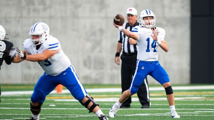 Waukee Northwest's Mack Heitland (14) throw the ball to an open receiver during a game against Roosevelt on Thursday, Sept. 12, 2024, at Mediacom Stadium in Des Moines. Waukee Northwest's Mack Heitland (14) throw the ball to an open receiver during a game against Roosevelt on Thursday, Sept. 12, 2024, at Mediacom Stadium in Des Moines.