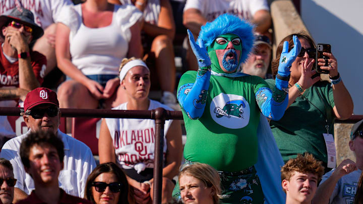 A Tulane fan cheers during a college football game between the University of Oklahoma Sooners (OU) and the Tulane Green Wave at Gaylord Family - Oklahoma Memorial Stadium in Norman, Okla., Saturday, Sept. 14, 2024.