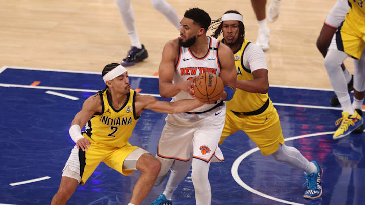Indiana Pacers' Andrew Nembhard steals the ball against New York Knicks center Karl-Anthony Towns in the 2025 NBA Playoffs
