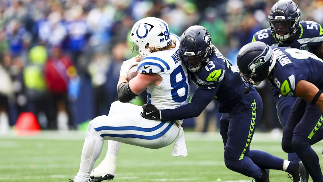 Dec 14, 2025; Seattle, Washington, USA; Seattle Seahawks linebacker Ernest Jones IV (13) tackles Indianapolis Colts tight end Tyler Warren (84) following a reception by Warren during the second quarter at Lumen Field. Mandatory Credit: Kevin Ng-Imagn Images
