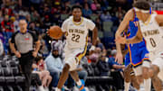 Nov 17, 2025; New Orleans, Louisiana, USA;  New Orleans Pelicans center Derik Queen (22) brings the ball up court against the Oklahoma City Thunder during the second half at Smoothie King Center. Mandatory Credit: Stephen Lew-Imagn Images