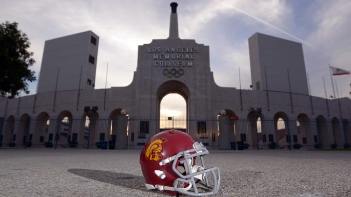 Mar 4, 2016; Los Angeles, CA, USA; General view of Southern California Trojans football helmet and the Olympic torch at the peristyle end of the Los Angeles Memorial Coliseum. The Coliseum operated by USC will serve as the temporary home of the Los Angeles Rams after NFL owners voted 30-2 to allow Rams owner Stan Kroenke (not pictured) to relocate the franchise from St. Louis for the 2016 season. Mandatory Credit: Kirby Lee-USA TODAY Sports