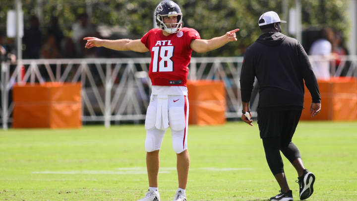 Aug 6, 2024; Miami Gardens, FL, USA; Atlanta Falcons quarterback Kirk Cousins (18) signals during a joint practice with the Miami Dolphins at Baptist Health Training Complex. Mandatory Credit: Sam Navarro-USA TODAY Sports