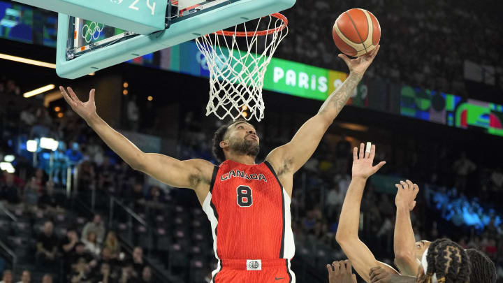 Aug 6, 2024; Paris, France; Canada centre Trey Lyles (8) shoots against France small forward Nicolas Batum (5) in the first quarter in a men’s basketball quarterfinal game during the Paris 2024 Olympic Summer Games at Accor Arena. Mandatory Credit: Kyle Terada-USA TODAY Sports