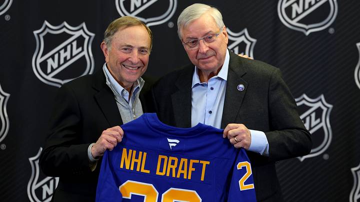 Jan 12, 2026; Buffalo, New York, USA;  NHL Commissioner Gary Bettman and Buffalo Sabres owner Terry Pegula pose for a photo during a press conference announcing the 2026 NHL Draft taking place in Buffalo at KeyBank Center. Mandatory Credit: Timothy T. Ludwig-Imagn Images