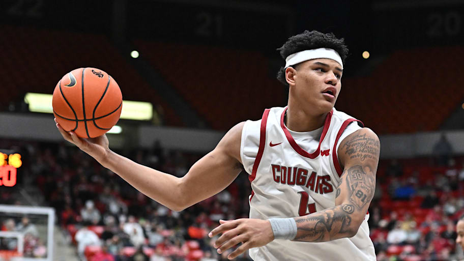 Washington State forward LeJuan Watts rebounds the ball.