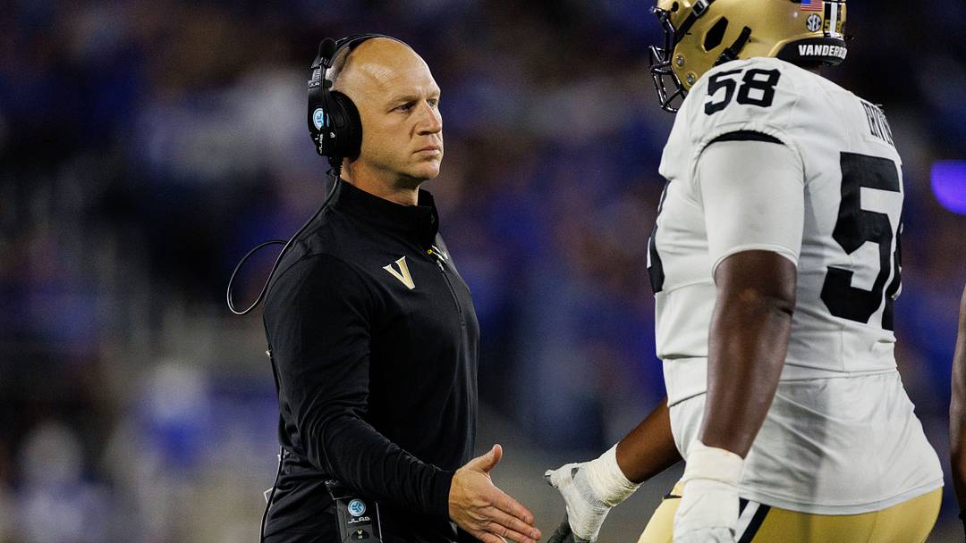 Oct 24, 2026; Lexington, Kentucky, USA;  Vanderbilt Commodores head coach Clark Lea fives Vanderbilt Commodores offensive lineman Orion Irving (58) during the first quarter against the Kentucky Wildcats at Kroger Field.  Mandatory Credit: Jordan Prather-Imagn Images