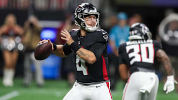 Aug 23, 2024; Atlanta, Georgia, USA; Atlanta Falcons quarterback Taylor Heinicke (4) throws a pass against the Jacksonville Jaguars in the second quarter at Mercedes-Benz Stadium.