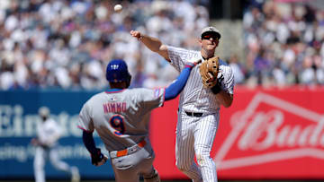 May 17, 2025; Bronx, New York, USA; New York Yankees second baseman DJ LeMahieu (26) forces out New York Mets left fielder Brandon Nimmo (9) at second base and throws to first to complete a double play on a ball hit by Mets designated hitter Mark Vientos (not pictured) during the sixth inning at Yankee Stadium. Mandatory Credit: Brad Penner-Imagn Images