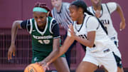 Peoria High’s Meriah Avant, right, tries to knock the ball away from Richwoods’ Keniya Todd in the first half of their high school basketball game Tuesday, Dec. 2, 2025 at Peoria High School. The Knights defeated the Lions 66-39.