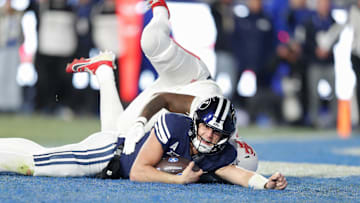 Jake Retzlaff dives across the goal line to score a touchdown against Houston.
