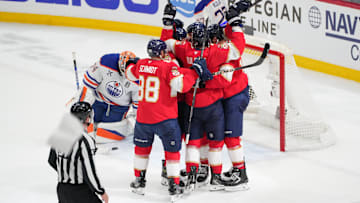 Jun 17, 2025; Sunrise, Florida, USA; Florida Panthers center Sam Reinhart (13) celebrates after his goal as Edmonton Oilers goaltender Stuart Skinner (74) watches during the second period in game six of the 2025 Stanley Cup Final at Amerant Bank Arena. Mandatory Credit: Jim Rassol-Imagn Images