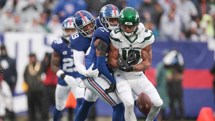 Oct 29, 2023; East Rutherford, NJ; New York Giants cornerback Cor'Dale Flott (28) breaks up a pass intended for New York Jets wide receiver Allen Lazard (10) during the first half at MetLife Stadium.