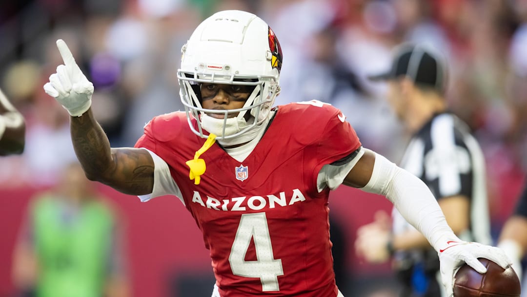 Jan 5, 2025; Glendale, Arizona, USA; Arizona Cardinals wide receiver Greg Dortch (4) celebrates after scoring a touchdown against the San Francisco 49ers in the first half at State Farm Stadium. Mandatory Credit: Mark J. Rebilas-Imagn Images