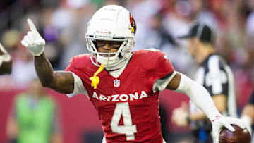 Jan 5, 2025; Glendale, Arizona, USA; Arizona Cardinals wide receiver Greg Dortch (4) celebrates after scoring a touchdown against the San Francisco 49ers in the first half at State Farm Stadium. Mandatory Credit: Mark J. Rebilas-Imagn Images