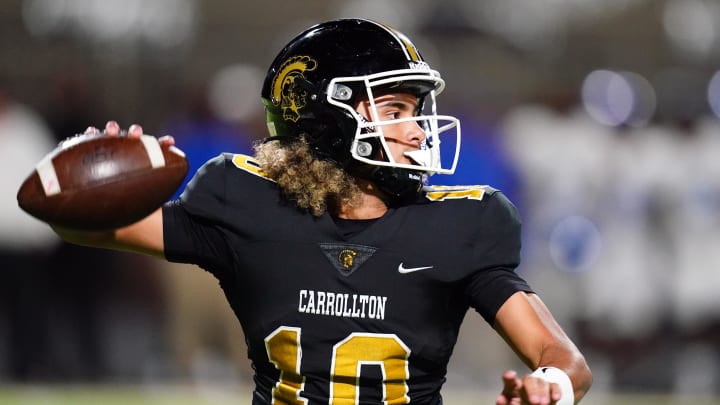 Oct 20, 2023; Carrollton, GA, USA; Carrollton Trojans quarterback Julian Lewis (10) drops back to pass against the Westlake Lions during the first half at Grisham Stadium. The 15-year-old Carrollton High student has already committed to playing for the University of Southern California Trojans and has been considered one of the top high school quarterback prospects. Mandatory Credit: John David Mercer-USA TODAY Sports