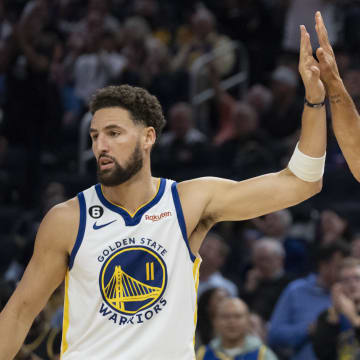 October 18, 2022; San Francisco, California, USA; Golden State Warriors guard Klay Thompson (11) high-fives guard Stephen Curry (30) against the Los Angeles Lakers during the second quarter at Chase Center. Mandatory Credit: Kyle Terada-USA TODAY Sports
