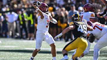 Sep 7, 2024; Iowa City, Iowa, USA; Iowa State Cyclones quarterback Rocco Becht (3) throws a pass as Iowa Hawkeyes defensive lineman Ethan Hurkett (49) rushes in during the second quarter at Kinnick Stadium. Mandatory Credit: Jeffrey Becker-Imagn Images
