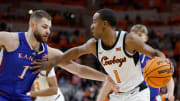 Oklahoma State Cowboys guard Bryce Thompson (1) tries to get past Kansas Jayhawks center Hunter