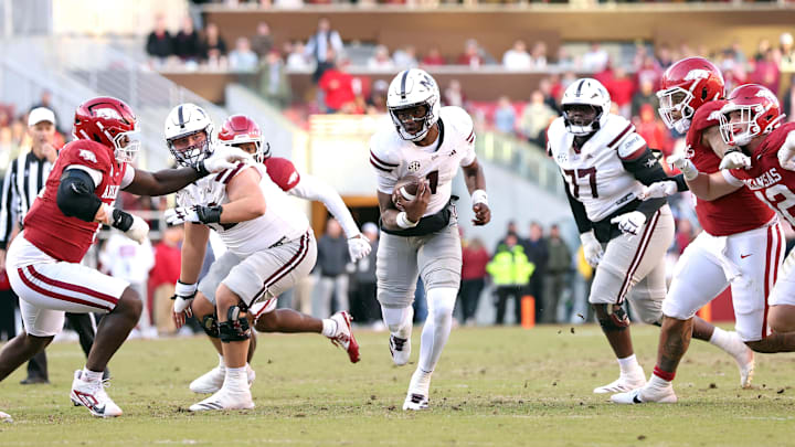 Nov 1, 2025; Fayetteville, Arkansas, USA; Mississippi State Bulldogs quarterback Kamario Taylor (1) rushes during the third quarter against the Arkansas Razorbacks at Donald W. Reynolds Razorback Stadium. Bulldogs won 38-35. Mandatory Credit: Nelson Chenault-Imagn Images