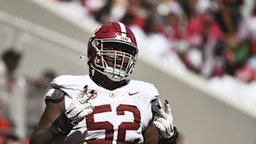 Apr 13, 2024; Tuscaloosa, AL, USA;  Alabama offensive lineman Tyler Booker (52) celebrates after the offense scored a touchdown during the A-Day scrimmage at Bryant-Denny Stadium. Mandatory Credit: Gary Cosby Jr.-USA TODAY Sports