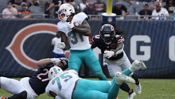 Miami Dolphins running back Ollie Gordon II (31) runs the ball against the Chicago Bears during the second half at Soldier Field on Sunday.