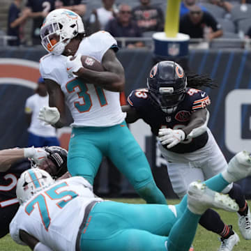 Miami Dolphins running back Ollie Gordon II (31) runs the ball against the Chicago Bears during the second half at Soldier Field on Sunday.