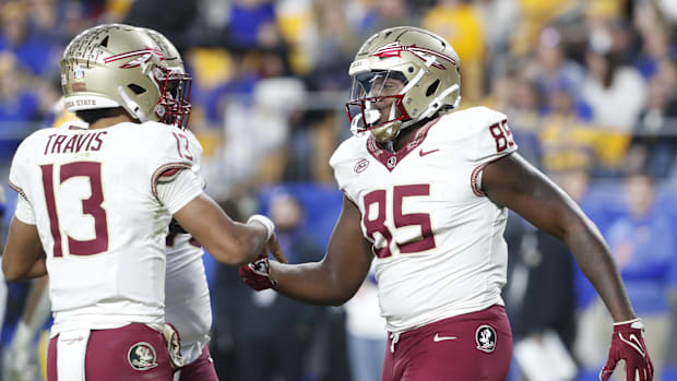 Florida State Seminoles quarterback Jordan Travis and tight end Markeston Douglas (85) celebrate.