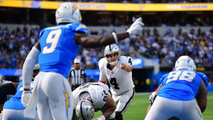 Oct 1, 2023; Inglewood, California, USA; Las Vegas Raiders quarterback Aidan O'Connell (4) scans the line of scrimmage against the Los Angeles Chargers during the second half at SoFi Stadium. Mandatory Credit: Gary A. Vasquez-USA TODAY Sports