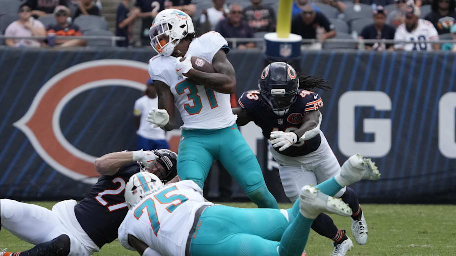 Miami Dolphins running back Ollie Gordon II (31) runs the ball against the Chicago Bears during the second half at Soldier Field on Sunday. | David Banks-Imagn Images