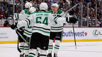 Apr 23, 2025; Denver, Colorado, USA; Dallas Stars left wing Jamie Benn (14) celebrates his goal with left wing Mason Marchment (27) and defenseman Thomas Harley (55) and center Mikael Granlund (64) in the third period against the Colorado Avalanche in game three of the first round of the 2025 Stanley Cup Playoffs at Ball Arena. Mandatory Credit: Isaiah J. Downing-Imagn Images