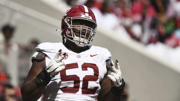 Apr 13, 2024; Tuscaloosa, AL, USA;  Alabama offensive lineman Tyler Booker (52) celebrates after the offense scored a touchdown during the A-Day scrimmage at Bryant-Denny Stadium. Mandatory Credit: Gary Cosby Jr.-USA TODAY Sports