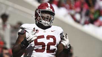 Apr 13, 2024; Tuscaloosa, AL, USA;  Alabama offensive lineman Tyler Booker (52) celebrates after the offense scored a touchdown during the A-Day scrimmage at Bryant-Denny Stadium. Mandatory Credit: Gary Cosby Jr.-Imagn Images