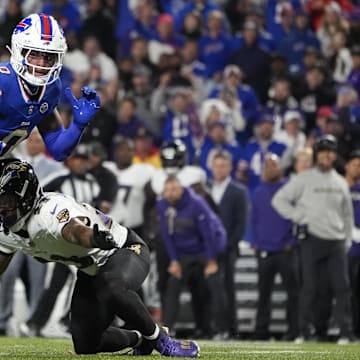 Sep 7, 2025; Orchard Park, New York, USA;  Buffalo Bills wide receiver Keon Coleman (0) runs the ball against Baltimore Ravens cornerback Jaire Alexander (23) during the fourth quarter at Highmark Stadium. Mandatory Credit: Gregory Fisher-Imagn Images