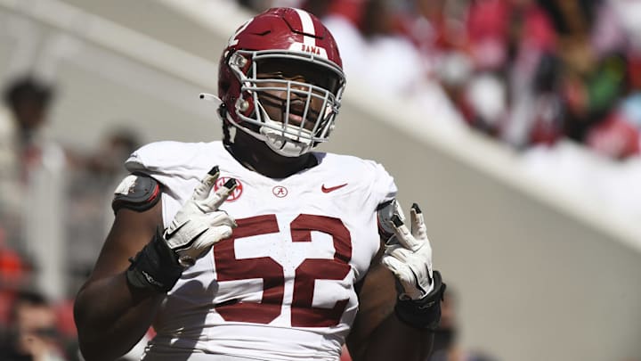 Apr 13, 2024; Tuscaloosa, AL, USA;  Alabama offensive lineman Tyler Booker (52) celebrates after the offense scored a touchdown during the A-Day scrimmage at Bryant-Denny Stadium. Mandatory Credit: Gary Cosby Jr.-Imagn Images