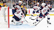 Nov 18, 2024; Boston, Massachusetts, USA;  Columbus Blue Jackets defenseman David Jiricek (55) looks for a rebound in front of goaltender Elvis Merzlikins (90) during the first period against the Boston Bruins at TD Garden. Mandatory Credit: Bob DeChiara-Imagn Images