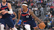 Oct 24, 2025; Inglewood, California, USA; Phoenix Suns forward Oso Ighodaro (11) guards Los Angeles Clippers guard Bradley Beal (0) as he drives to the basket in the first half at Intuit Dome. Mandatory Credit: Jayne Kamin-Oncea-Imagn Images