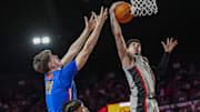 Feb 25, 2025; Athens, Georgia, USA; Georgia Bulldogs guard Dakota Leffew (1) takes a rebound from Florida Gators forward Alex Condon (21) during the second half at Stegeman Coliseum. Mandatory Credit: Dale Zanine-Imagn Images