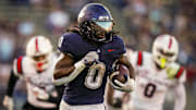 Sep 20, 2025; East Hartford, Connecticut, USA; Connecticut Huskies running back Cam Edwards (0) runs the ball for a touchdown against et Ball State Cardinals in the second half at Pratt & Whitney Stadium at Rentschler Field. Mandatory Credit: David Butler II-Imagn Images