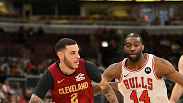 Oct 9, 2025; Chicago, Illinois, USA; Cleveland Cavaliers guard Lonzo Ball (2) drives the ball against Chicago Bulls forward Patrick Williams (44) during the first half at United Center. Mandatory Credit: Patrick Gorski-Imagn Images