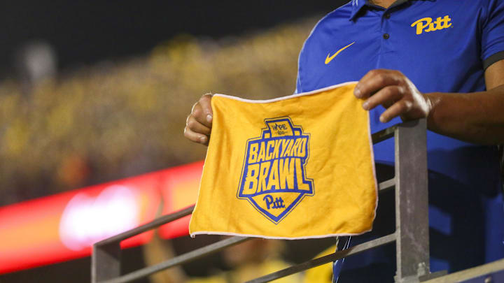 Sep 16, 2023; Morgantown, West Virginia, USA; A Pittsburgh Panthers fan holds a towel during the second quarter against the West Virginia Mountaineers at Mountaineer Field at Milan Puskar Stadium. Mandatory Credit: Ben Queen-Imagn Images