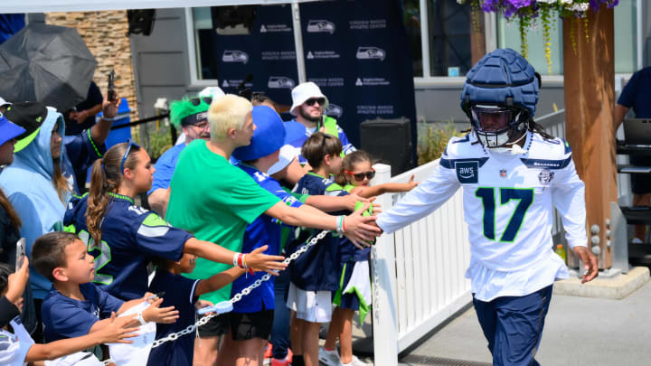 Jul 27, 2024; Renton, WA, USA; Seattle Seahawks linebacker Jerome Baker (17) interacts with fans before training camp at Virginia Mason Athletic Center. Mandatory Credit: Steven Bisig-USA TODAY Sports