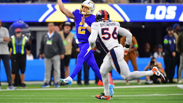 Dec 10, 2023; Inglewood, California, USA; Los Angeles Chargers quarterback Easton Stick (2) throws under pressure from Denver Broncos linebacker Baron Browning (56) during the second half at SoFi Stadium. Mandatory Credit: Gary A. Vasquez-Imagn Images Dec 10, 2023; Inglewood, California, USA; Los Angeles Chargers quarterback Easton Stick (2) throws under pressure from Denver Broncos linebacker Baron Browning (56) during the second half at SoFi Stadium. Mandatory Credit: Gary A. Vasquez-Imagn Images