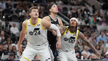 Nov 9, 2024; San Antonio, Texas, USA;  Utah Jazz center Walker Kessler (24) and guard Jordan Clarkson (00) block San Antonio Spurs forward Zach Collins (23) in the second half at Frost Bank Center. Mandatory Credit: Daniel Dunn-Imagn Images