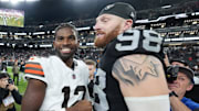 Nov 23, 2025; Paradise, Nevada, USA; Las Vegas Raiders defensive end Maxx Crosby (98) and Cleveland Browns quarterback Shedeur Sanders (12) embrace after the game at Allegiant Stadium. Mandatory Credit: Kirby Lee-Imagn Images